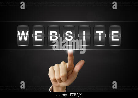 business hand pushing website on Flipboard Display Stock Photo