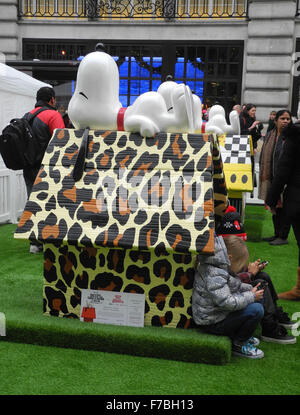London, UK. 28th Nov, 2015. The 'Snoopy Spice' dog house designed by singer Melanie Brown is on display prior to the theatrical release of 'The Peanuts Movie' in London, England, 28 November 2015. About a dozen of the colourful houses are to be auctioned off through the internet, with the proceeds to be donated to relief organisations. Photo: TERESA DAPP/dpa/Alamy Live News