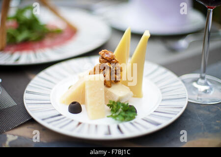 Gourmet Appetizers with various cheese on a table Stock Photo