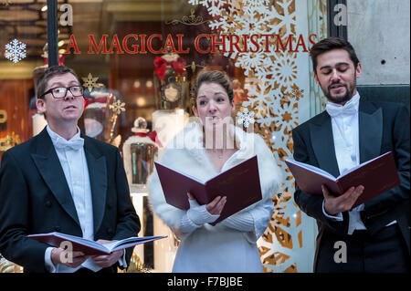 London, UK.  28 November 2015.  A trio of carol singers entertain shoppers on Regent Street bringing a little early Christmas cheer.  Credit:  Stephen Chung / Alamy Live News Stock Photo