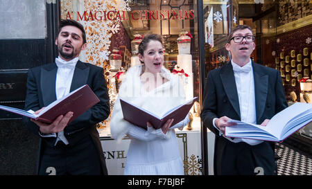 London, UK.  28 November 2015.  A trio of carol singers entertain shoppers on Regent Street bringing a little early Christmas cheer.  Credit:  Stephen Chung / Alamy Live News Stock Photo