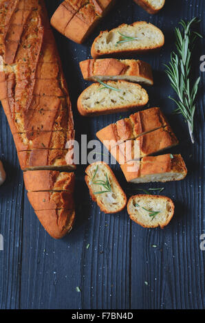 fresh garlic bread baguette made with butter and rosemary Stock Photo