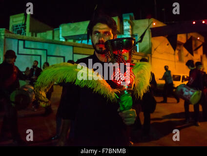 Iranian Shiite Muslim Man Holding An Incense Burner During Ashura, The Day Of The Death Of Imam Hussein, Isfahan Province, Kashan, Iran Stock Photo