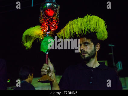 Iranian Shiite Muslim Man Holding An Incense Burner During Ashura, The Day Of The Death Of Imam Hussein, Isfahan Province, Kashan, Iran Stock Photo