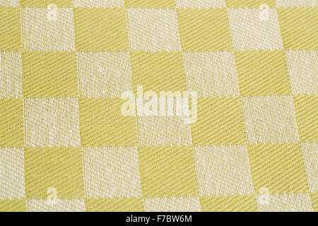 Checkered tablecloth texture as a background, closeup picture. Stock Photo