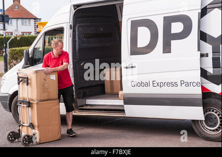 A DPD delivery driver delivering parcels in Southwold , Suffolk , England , Britain , Uk