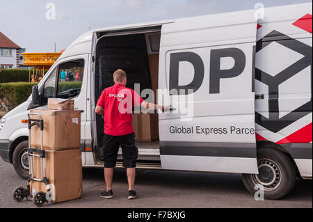 A DPD delivery driver delivering parcels  in Southwold , Suffolk , England , Britain , Uk Stock Photo