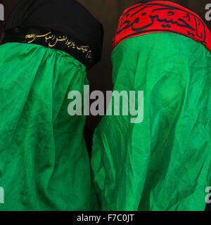 Iranian Shiite Muslim Women Mourning Imam Hussein On The Day Of Tasua With Their Faces Covered By A Green Veil, Lorestan Province, Khorramabad, Iran Stock Photo