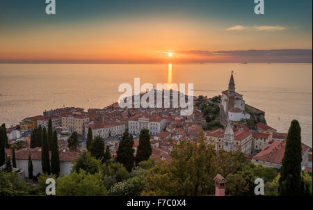 Sunset Over Adriatic Sea and Picturesque Old Town of Piran, Slovenia. Aerial View. Stock Photo
