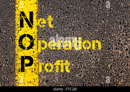 Concept image of Business Acronym NOP as Net Operation Profit written over road marking yellow paint line. Stock Photo