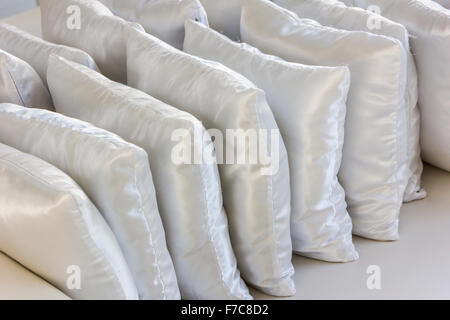 white pillows leather on cushion Stock Photo
