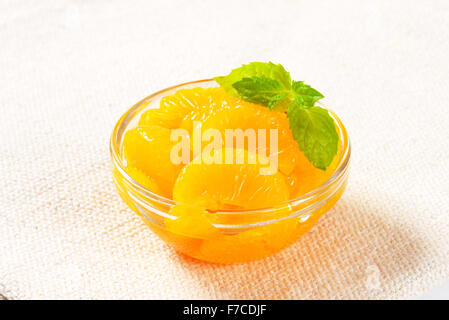 Bowl of peeled mandarin orange segments in light syrup Stock Photo