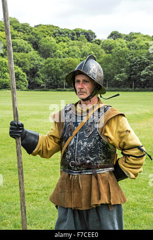 A member of the Sealed Knot society dressed as a pike man in the Parliamentarian army during an english civil war reanactment Stock Photo