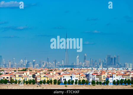 Skyline of Dubai with modern luxury villas at The Villa residential housing development in foreground in United Arab Emirates Stock Photo