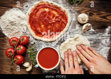 Fresh original Italian raw pizza preparation Stock Photo