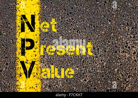 Concept image of Business Acronym NPV as Net Present Value written over road marking yellow paint line. Stock Photo