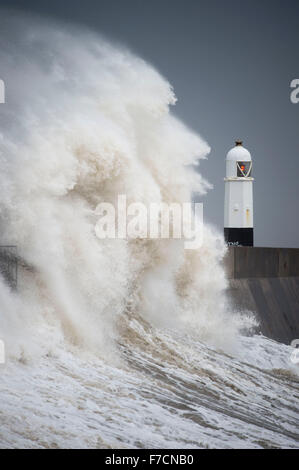 Large waves crash against the harbour wall in Porthcawl, South Wales, as storm Clodagh sweeps across South Wales. Stock Photo