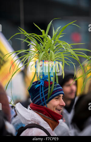 Berlin, Germany. 29th Nov, 2015. A demonstrator wears a plant pot on his head during the 'Global Climate March' in Berlin, Germany, 29 November 2015. The United Nations Climate Change Conference will be held in Paris, France, from 30 November to 11 December 2015. Photo: GREGOR FISCHER/dpa/Alamy Live News Stock Photo