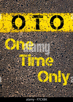 Concept image of Accounting Business Acronym OTO One Time Only written over road marking yellow paint line. Stock Photo