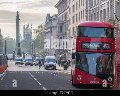 The number 453 bus approaches Piccadilly with the Houses of Parliament in the background Stock Photo