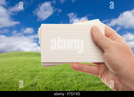 Male Hand Holding Stack of Flash Cards Isolated on a White Background. Stock Photo