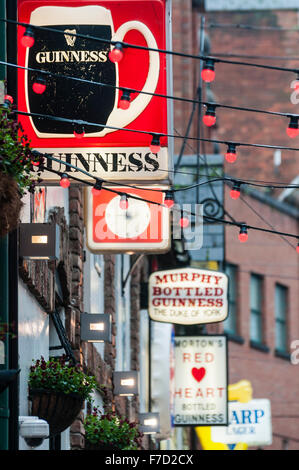 Signs advertising Guinness and other beers at the Duke of York pub in Belfast Stock Photo