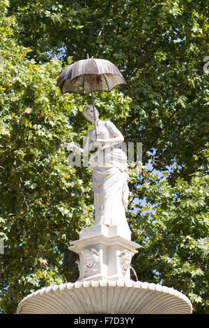 The lady with the umbrella statue in the Parc de la Ciutadella Stock Photo