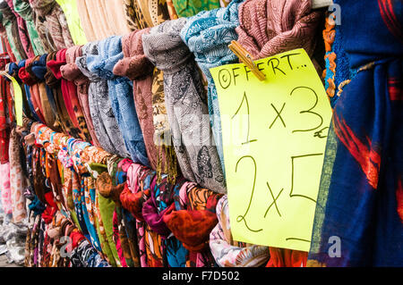 Price label on silk scarves on sale in a stall at the Sunday Market in the Lanzarote town of Teguise Stock Photo