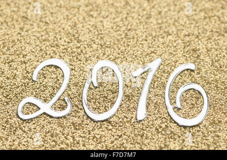 New Year 2016 numbers on golden background Stock Photo