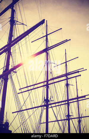 Retro vintage toned sailing masts at sunset, travel concept. Stock Photo