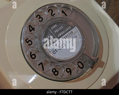 Cream GPO telephone type 746 with 01 London number on rotary dial, UK Stock Photo