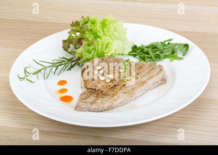 Grilled tuna steak with rosemary and cedar nut Stock Photo