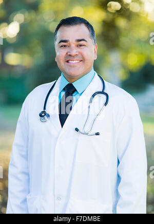 Smiling Handsome Hispanic Male Doctor Portrait Outdoors. Stock Photo