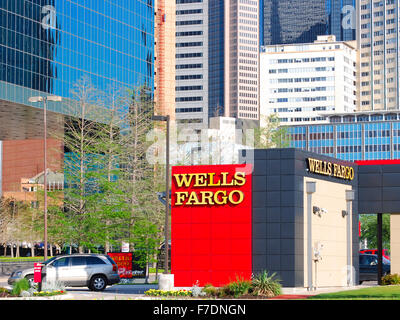 Wells Fargo branch in downtown Dallas, Texas with skyscrapers and office buildings in the background. Stock Photo