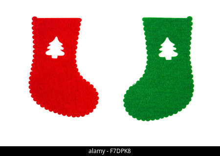 hand made red and green christmas sock with christmas tree cut out on white Stock Photo