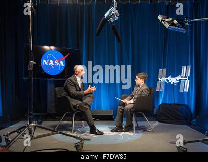 NASA Administrator Charles Bolden is interviewed by nine-year old Max from Humans of New York at NASA Headquarters November 23, 2015 in Washington, DC. Max was featured on the HONY Facebook page on Nov. 14 stating he'd like to be a reporter like his dad, 'I'd start by going to the Director of NASA. Then I'd ask him about his rockets. And if any of them were going to space. Stock Photo