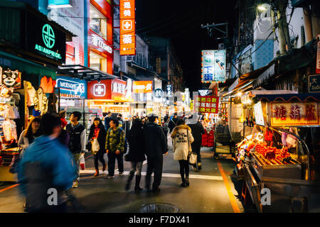 Taipei, Taiwan - January 30, 2015: The view of Shilin night market at night with many tourists. Stock Photo