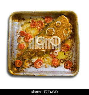 breaded fish in  roasting pan. Isolated over white Stock Photo