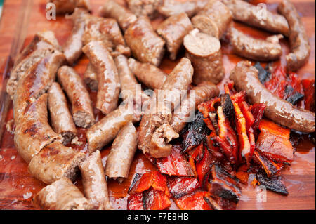 Traditional South African Boerwors sausage cooks on a Braai, or South African barbecue..  Durban South Africa. Stock Photo