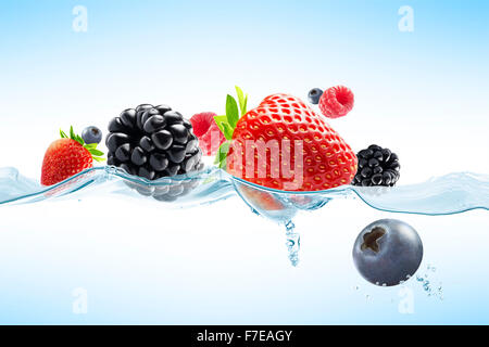 close up view of nice fresh berries on blue background Stock Photo