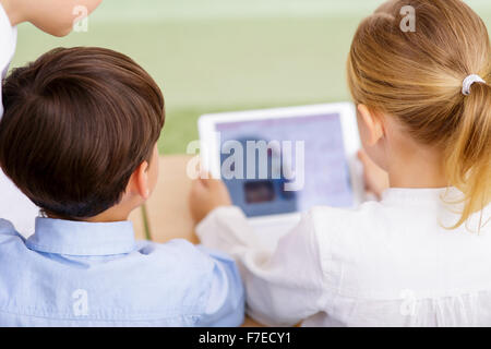 Children using portable tablet. Stock Photo