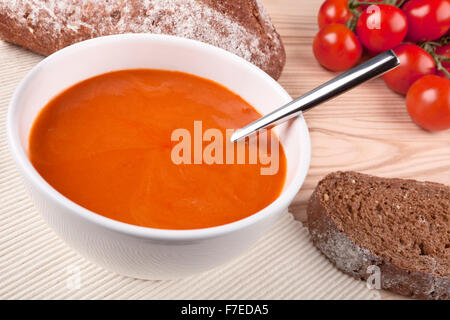 Tomato soup with rustic bread. Stock Photo