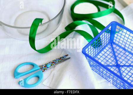 Handcraft concept with scissors basket and ribbon This image has a restriction for licensing in Israel Stock Photo