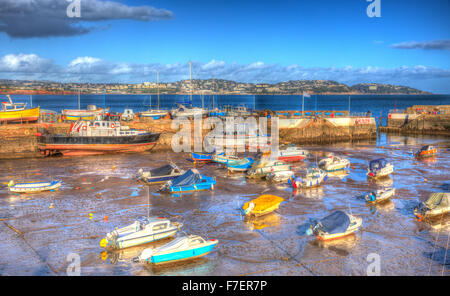 Paignton harbour Devon England uk in colourful HDR with boats at low tide and view to Torquay Stock Photo