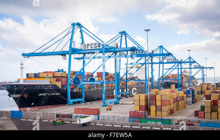 Shipping containers and container ship in Las Palmas port (Puerto de La Luz) on Gran Canaria, Canary Islands, Spain Stock Photo