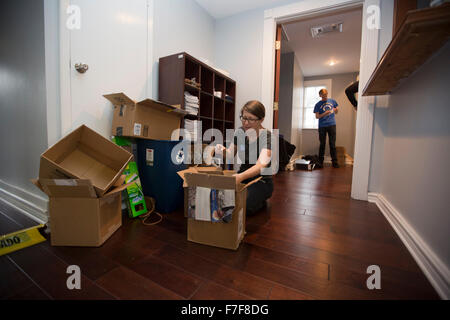 Volunteers help unpack and organize office of Texans for Bernie Sanders in preparation of the opening of the office Stock Photo