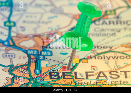 Green pushpin on the Northern Ireland map showing Belfast location Stock Photo