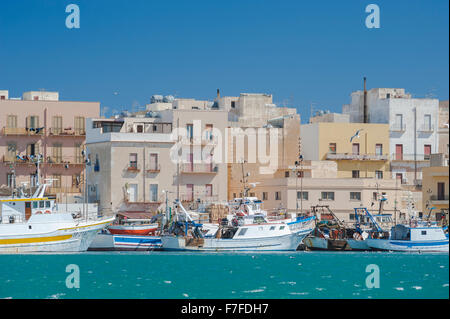 Sicily coast town, fishing boats moored along the quayside in Trapani harbor,  Sicily.