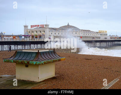 Brighton, UK. 30th Nov, 2015. With winds gusting to  60 mph, and an almost deserted beach, the pier in Brighton faced stormy seas.  Scott Hortop/Alamy Live News Stock Photo