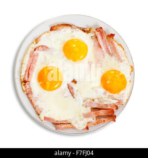 fried eggs with bacon on plate. Isolated over white Stock Photo